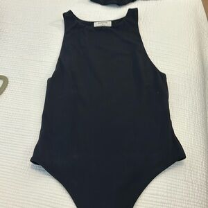 Black muscle bodysuit by Babaton size S great condition no piling